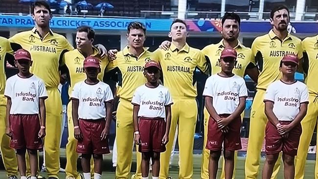 The Australian side singing the national anthem in Lucknow with Adam Zampa in the centre