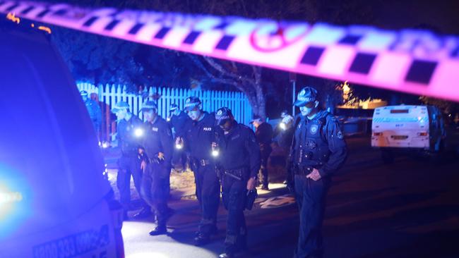 Police conduct a line search following the drive-by shooting. Picture: Adam Taylor