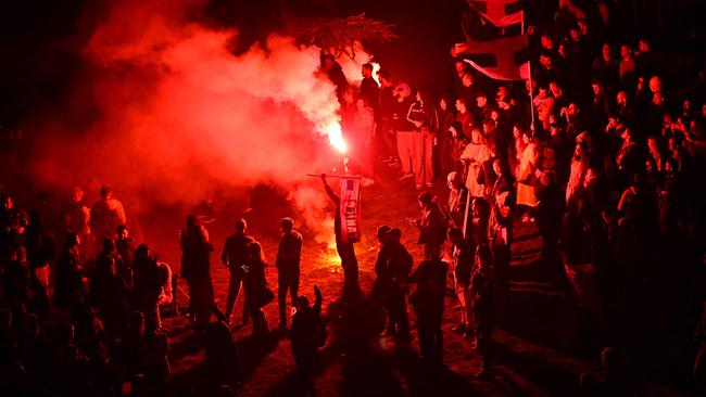 Protesters burn flares as thousands of people from all over Serbia gather to take part in one of the largest anti-corruption demonstrations. Picture: Andrej Isakovic/AFP