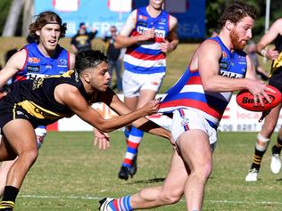 Cental's Jarrod Schiller is tackled by Tiger's  Ian Millera              at the SANFL's Central Bulldogs vs Glenelg Tigers at My Money House val, Elizabeth South.picture: Bianca De Marchi