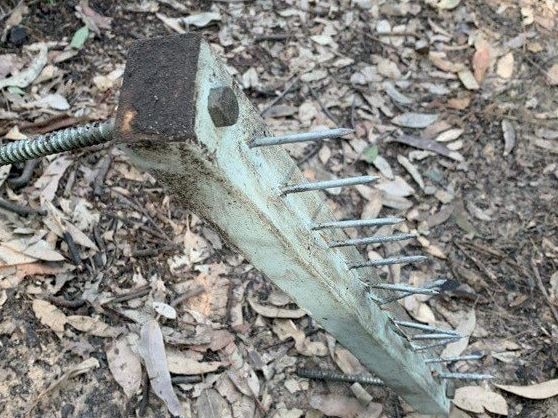 A booby trap of nails poking out of wood that was left on a popular mountain bike trail on the Central Coast. Picture: supplied