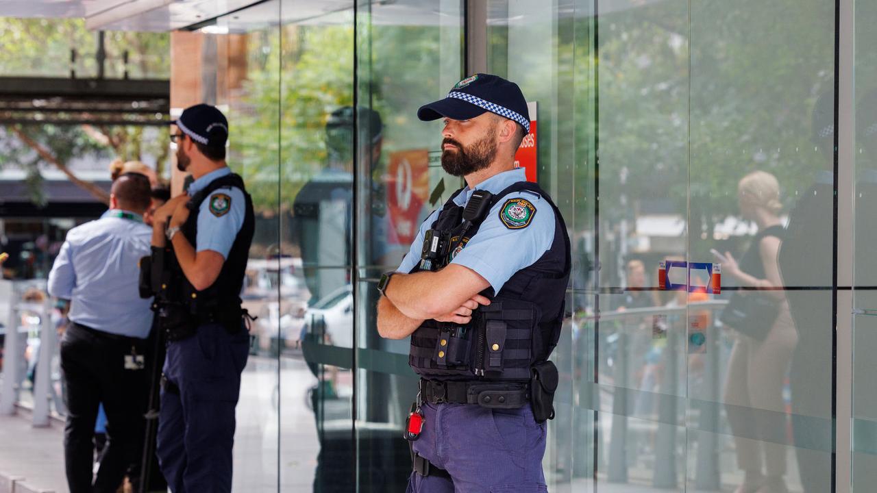 Police stand guard at the door. Picture: NCA NewsWire / David Swift