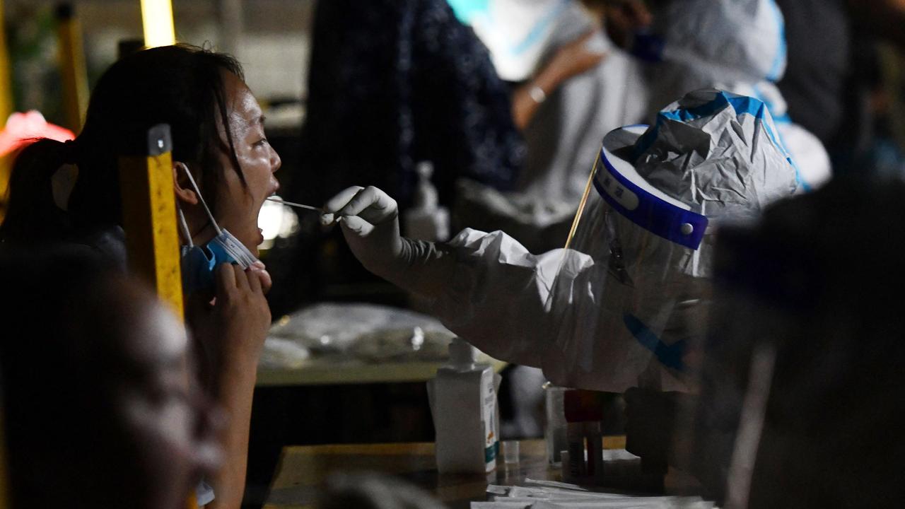 This photo taken on September 1 shows a health worker taking a swab sample from a resident to test for the Covid-19 in Chengdu. Picture: CNS/AFP