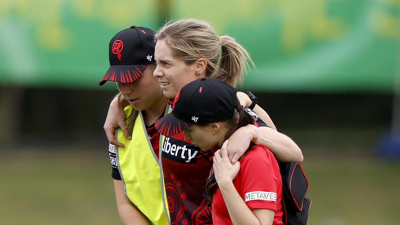 Sophie Molineux of the Renegades is assisted off the field after injuring her knee while bowling in the WBBL last year (Photo by Jonathan DiMaggio/Getty Images)