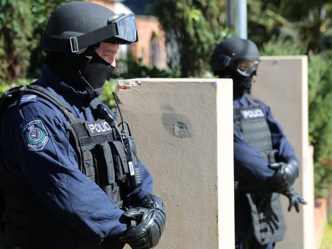 Police stand guard outside the Merrylands property this afternoon. Picture: Supplied