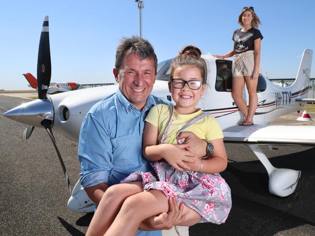 Pilot Shaun Aisen pictured with five-year-old Savannah Gifford and Mum Teigan who travelled to Melbourne with Angel Flight. Picture: Alex Coppel