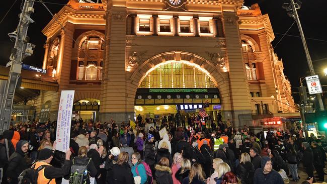 Protesters gather at Flinders Street Station to protest the seven-day Covid lockdown. Picture: Jason Edwards