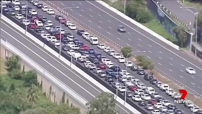 Traffic chaos, drivers u-turn to avoid crash. Courtesy: 7 News Queensland