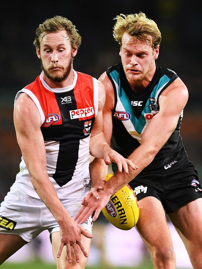 Saint Jimmy Webster and Port’s Jack Watts collide at Adelaide Oval on Saturday. Picture: Mark Brake/Getty Images