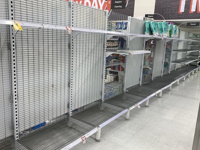 Empty toilet paper shelf. Empty shelves of basic supplies at Coles in Five Dock. Picture Rohan Kelly