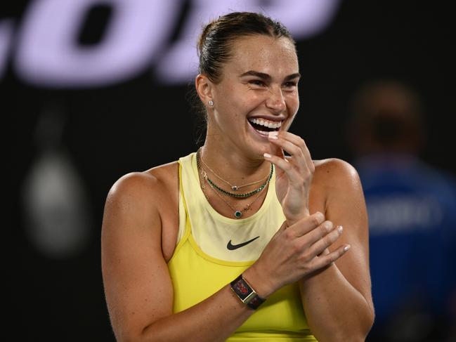 MELBOURNE, AUSTRALIA - JANUARY 23: Aryna Sabalenka smiles while interviewed after winning against Paula Badosa of Spain in the Women's Singles Semifinal during day 12 of the 2025 Australian Open at Melbourne Park on January 23, 2025 in Melbourne, Australia. (Photo by Hannah Peters/Getty Images)