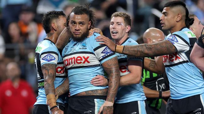 Addin Fonua-Blake of the Sharks celebrates with teammates after scoring a try during the round one NRL match between the Penrith Panthers and the Cronulla Sharks at Allegiant Stadium on March 01, 2025, in Las Vegas, Nevada. (Photo by Ezra Shaw/Getty Images)