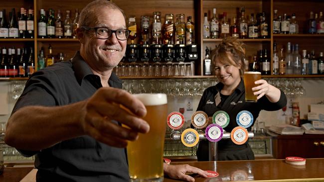 Manager of the Hotel Metropolitan, Damian Peterson, would like to see staff Covid vaccines made mandatory. He is pictured with fully vaccinated staff member Malou Helder. Picture: NCA NewsWire / Naomi Jellicoe