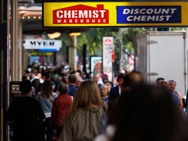 SYDNEY, AUSTRALIA - NewsWire Photos, October 29 2024. GENERIC. Inflation. Shopping. Retail. Economy. Cost of living crisis. Crowded footpath beneath a Chemist Warehouse sign. Picture: NewsWire / Max Mason-Hubers