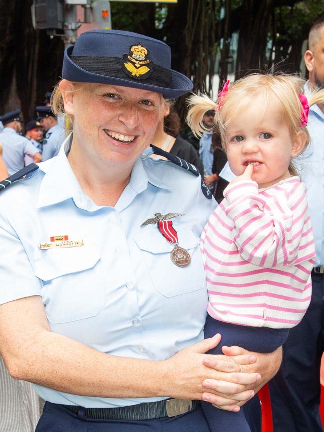 Thousands of people have braved the rain to gather in Brisbane for Anzac Day services. Picture: Grace Kessels