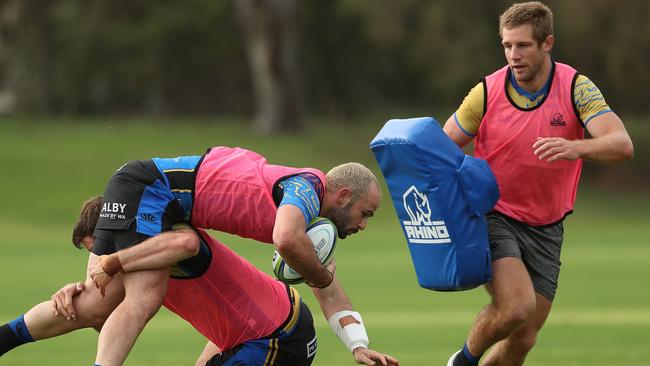 Force players Greg Holmes, Jono Lance and Kyle Godwin go hard at training ahead of their return to Super Rugby against the Waratahs on Saturday night. Picture: Getty Images