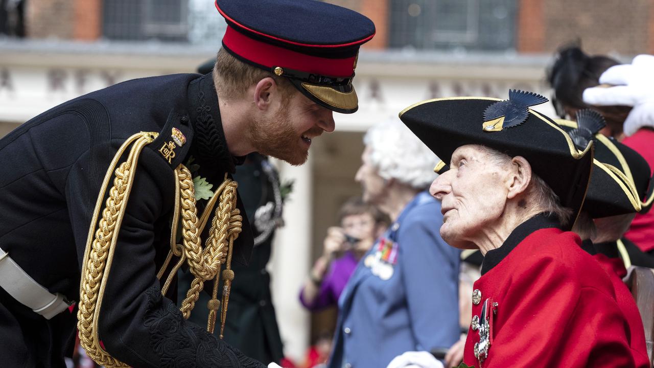 Prince Harry shakes hands with a Chelsea Pensioner. Picture: Heathcliff O'Malley — WPA Pool/Getty Images