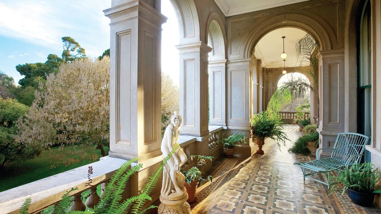 Statues and plants surround the balconies.