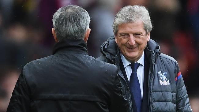 Jose Mourinho, Manager of Manchester United and Roy Hodgson, Manager of Crystal Palace shake hands.