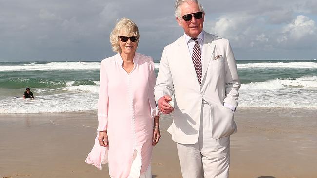 Prince Charles, Prince of Wales (right) and Camilla, Duchess of Cornwall walk on Broadbeach, Queensland, Thursday, April 5, 2018. The Prince of Wales and Duchess of Cornwall are on a seven-day tour of Australia, visiting Queensland and the Northern Territory. (AAP Image/Getty Images Pool/Mark Metcalfe) NO ARCHIVING