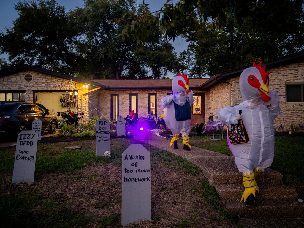 Trick-or-Treaters dressed as chickens run together after receiving candy in the Allandale neighbourhood in Austin, Texas. Picture: Brandon Bell/Getty Images