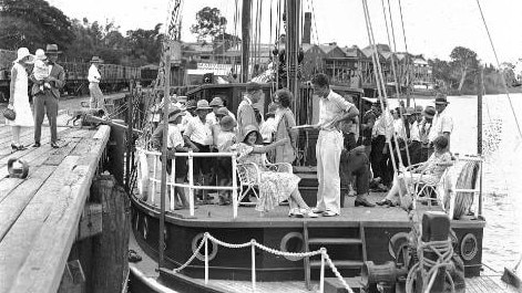 Sailing vessel near Maryborough Rowing Club, c. 1920–1939. A peaceful scene of a berthed vessel with passengers enjoying the Mary River. Source: Unknown