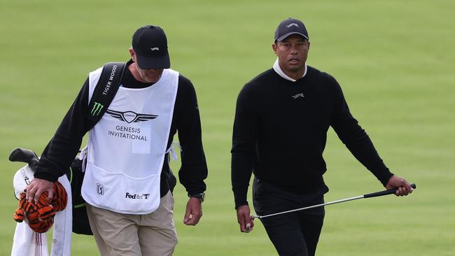 Tiger Woods and his caddie Lance Bennett walks the ninth hole d at Riviera Country Club . (Photo by Harry How/Getty Images)