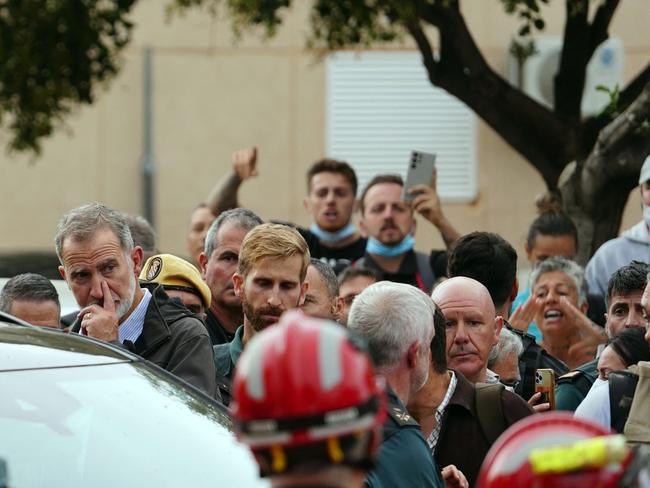 King Felipe VI of Spain is heckled by angry residents during his visit to Paiporta. Picture: AFP