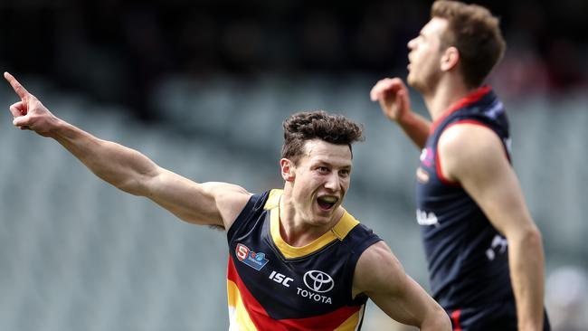 Young Crow James Mathews celebrates one of four goals as Adelaide moved on to the preliminary final and Norwood’s season ended. Picture SARAH REED