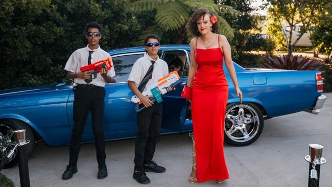 Kiri-Anna with protective escorts at the Glasshouse Christian College formal. Picture: Jordan Bull of JBull Photography