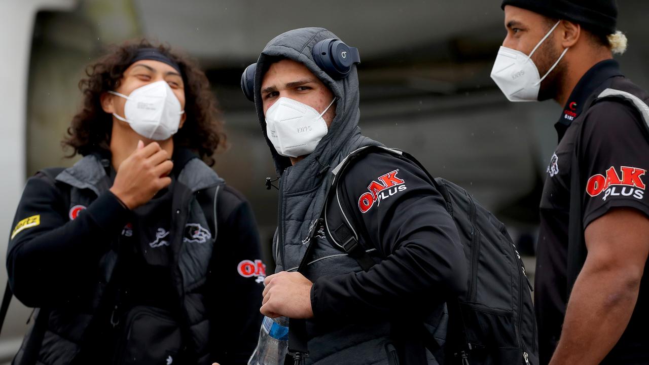 NRL teams depart Sydney via Jet Aviation at Mascot to the hub in Queensland due to the Covid-19 outbreak and lockdown in Sydney. Teams will enter a bubble on the Gold Coast and Sunshine Coast to keep the competition going. The Panthers squad including Jarome Luai (L) and Nathan Cleary (R) board one of the Virgin planes. Picture: Toby Zerna