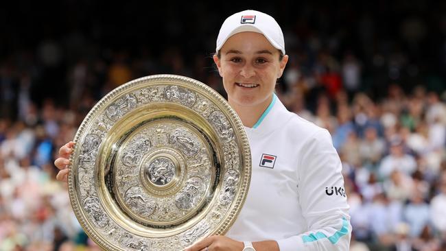 MARCH 23, 2022: World number 1 and three-time Grand Slam winner Ash Barty has announced her retirement from tennis at the age of 25. LONDON, ENGLAND - JULY 10: Ashleigh Barty of Australia celebrates with the Venus Rosewater Dish trophy after winning her Ladies' Singles Final match against Karolina Pliskova of The Czech Republic  on Day Twelve of The Championships - Wimbledon 2021 at All England Lawn Tennis and Croquet Club on July 10, 2021 in London, England. (Photo by Clive Brunskill/Getty Images)