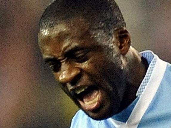 Manchester City's Ivorian midfielder Yaya Toure celebrates scoring his goal during the English Premier League football match between Stoke City and Manchester City at The Britannia stadium, Stoke-on-Trent, England, on March 24, 2012. AFP PHOTO/PAUL ELLIS RESTRICTED TO EDITORIAL USE. No use with unauthorized audio, video, data, fixture lists, club/league logos or �live� services. Online in-match use limited to 45 images, no video emulation. No use in betting, games or single club/league/player publications.