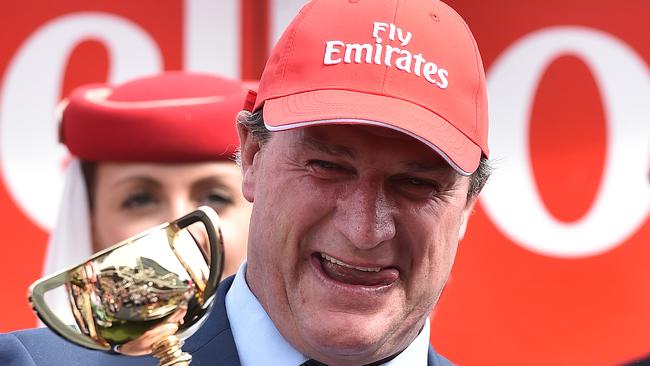 Trainer Darren Weir celebrates with the Melbourne Cup.