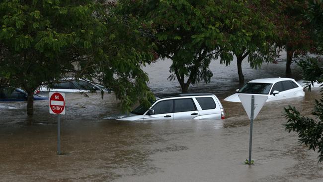 Cars submerged at the rear of the Robina Hospital during the aftermath of Cyclone Debbie. Picture: NIGEL HALLETT