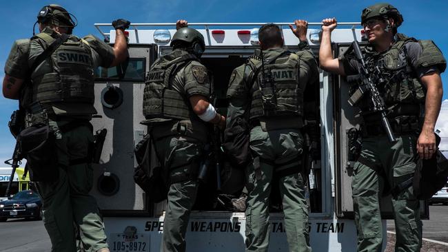 Tactical response officers arrive at the scene. Picture: AFP