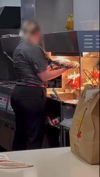 McDonald's manager is seen drying a mop under the fries warmer