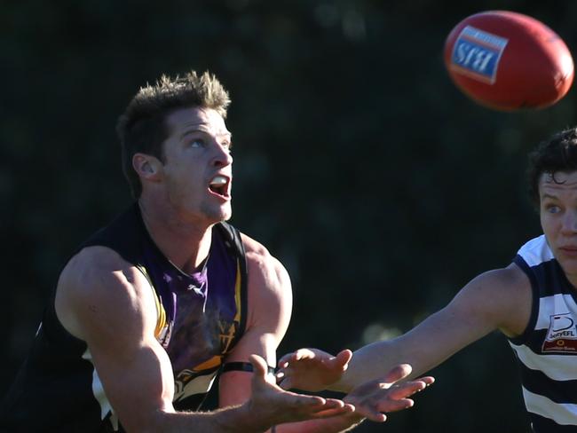 Melbourne Australia - July1 David Johnson of Norwood takes a mark as Chris Tout of Doncaster is in pursuit, during the EFL (Division 1) game between Norwood and Doncaster played at Mullum reserve July 1, 2017.Picture: Stuart Milligan