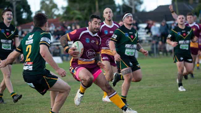 Shellharbour Stingrays Vs Sharks. James Ralphs side stepping the defence to go to score the try. Picture: Thomas Lisson