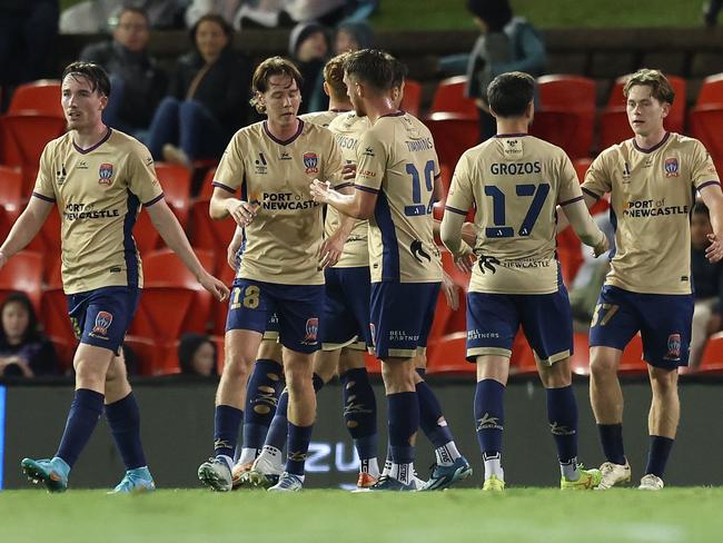 NEWCASTLE, AUSTRALIA - APRIL 19: The Jets celebrate a goal that was scored after it deflected off Phoenix goalkeeper Alexander Paulsen during the A-League Men round 25 match between Newcastle Jets and Wellington Phoenix at McDonald Jones Stadium, on April 19, 2024, in Newcastle, Australia. (Photo by Scott Gardiner/Getty Images)