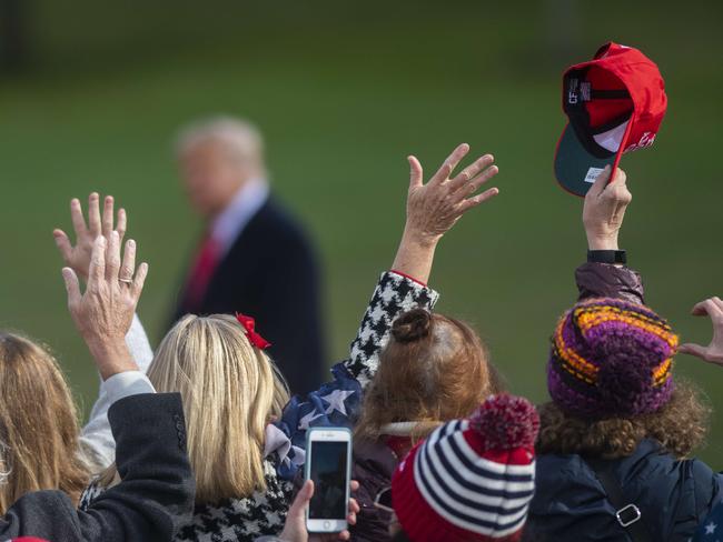 Supporters cheer as President Donald Trump arrives at a rally in Newtown, Pennsylvania.