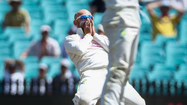 Nathan Lyon reacts to a near miss late in the day. Picture: AFP