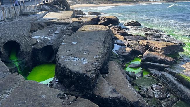 The source of the bright green liquid was tracked down to a nearby pipe. Picture: Elizabeth Pike