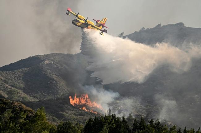 Firefighters said more than 260 firefighters were still battling flames for an eighth consecutive day on Rhodes