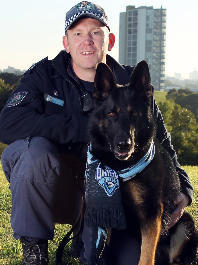 Senior Constable Luke Warburton with police dog Chuck.