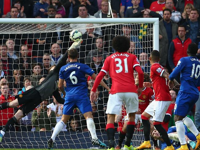 David De Gea tips over Bryan Oviedo’s shot at Old Trafford