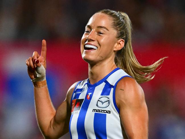 MELBOURNE, AUSTRALIA - NOVEMBER 30: Alice O'Loughlin of the Kangaroos celebrates kicking a goal during the AFLW Grand Final match between North Melbourne Tasmanian Kangaroos and Brisbane Lions at Ikon Park, on November 30, 2024, in Melbourne, Australia. (Photo by Quinn Rooney/Getty Images)