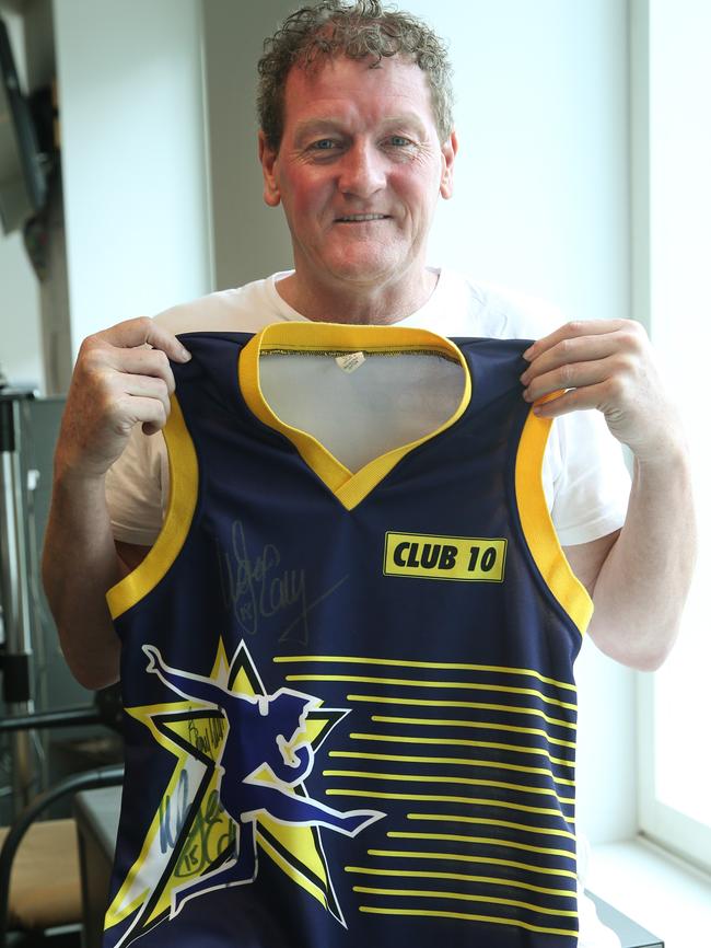 Ricky Nixon shows off an old Club 10 branded guernsey. Picture: Michael Klein