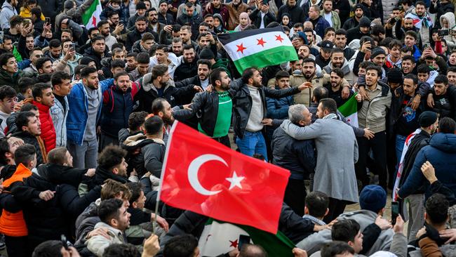 Syrian residents in Istanbul cheer as they celebrate the end of the Baath rule in Syria after rebel fighters took control of Damascus. Picture: AFP