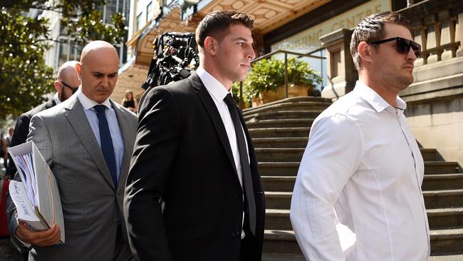 Curtis Scott (centre) leaves the Downing Centre Local Court. Picture: AAP/Bianca De Marchi